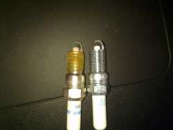 Original spark plugs when compared to new spark plugs