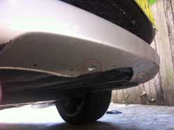 Location of four 8mm self taping screws used to affix the bumper to the front air deflector assembly